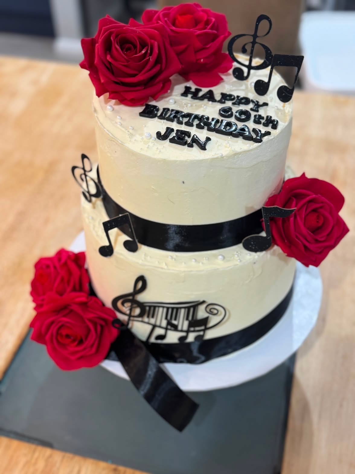 Two tier 60th with red roses and music notes